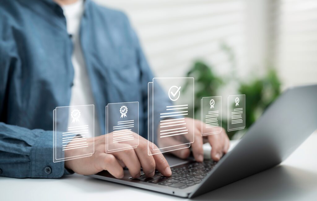Man typing on keyboard with graphic overlay of a ticked checklist, portraying a Data Protection Impact Assessment being completed.